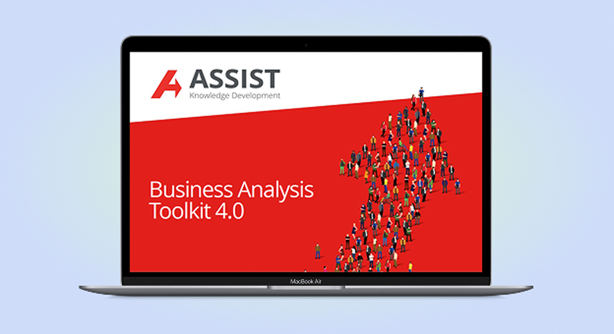 The AssistKD Business Analysis Toolkit on a laptop screen